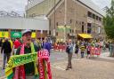 A half-and-half scarf seller outside of Carrow Road as fans arrive for the game against Liverpool