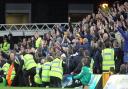 The traveling Leeds fans celebrate their side's 3rd goal during the Sky Bet Championship match at Carrow Road, Norwich in 2016. Picture by Paul Chesterton/Focus Images Ltd.