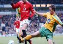 Two worlds collide - Adam Drury tackles Cristiano Ronaldo during a Premier League game at Carrow Road in April, 2005 Picture: PA