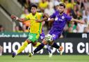 Onel Hernandez and Charlie Goode compete for the ball