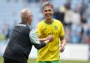 Manchester City loanee Callum Doyle is all smiles with Norwich City assistant head coach Glen Riddersholm