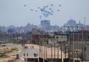 An aircraft airdrops humanitarian aid over the northern Gaza Strip (AP