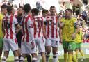 Kenny McLean and Ben Wilmot share a difference of opinion in Norwich City's 1-1 Championship draw at Stoke City