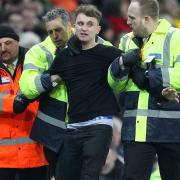 A Notts Forest fan invades the pitch and is ejected by stewards during the Sky Bet Championship match at Carrow Road, NorwichPicture by Paul Chesterton/Focus Images Ltd +44 7904 64026706/03/2018