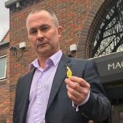 Spencer Clay outside Norwich Magistrates Court with a sweet like the one he threw at Norwich fans. PIC: Peter Walsh