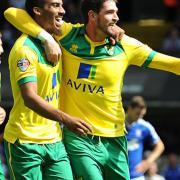 Norwich City's Lewis Grabban (left) celebrates with Kyle Lafferty (right) after scoring against Ipswich Town at Portman Road two years ago. Pic: Nigel French/PA Wire.