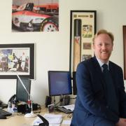 Dan Chapman, senior partner at Full Contact sports agency, in his office with signed photographs and memorabilia of some of his clients.  Picture: DENISE BRADLEY