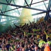 A flare is let off during the first leg of the Championship play-off semi-final at Ipswich Towns Portman Road ground.