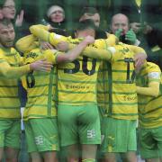 Josh Sargent is mobbed after sealing Norwich City's 1-0 Championship win over Sunderland