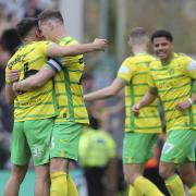 Kenny McLean hugs Norwich City's Championship derby match winner Marcelino Nunez after a 1-0 win over Ipswich Town