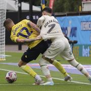 Borja Sainz tussles for the ball in Norwich City's 2-0 Championship defeat at Oxford