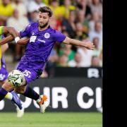 Onel Hernandez and Charlie Goode compete for the ball