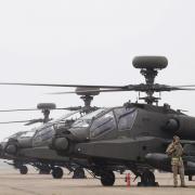 British Army Apache AH-64E attack helicopters are prepared for take off (PA)