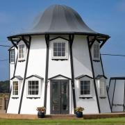 Dutch Tutch, on the River Thurne in Potter Heigham, Norfolk, was constructed from an old helter-skelter (Historic England Archive/PA)