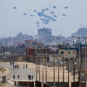 An aircraft airdrops humanitarian aid over the northern Gaza Strip (AP