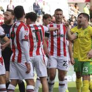 Kenny McLean and Ben Wilmot share a difference of opinion in Norwich City's 1-1 Championship draw at Stoke City