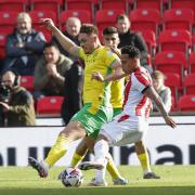 Callum Doyle battles for possession during the 1-1 draw at Stoke