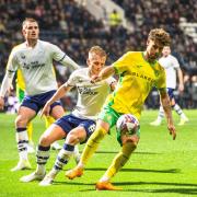 Norwich City's Emiliano Marcondes shields the ball from the Preston North End defenders